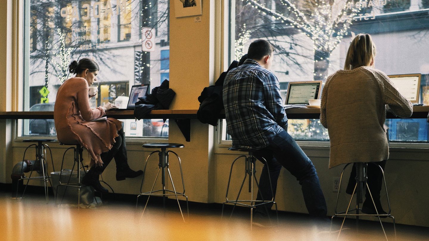Digital nomads working in a cafe